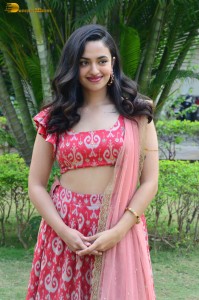 south actress malvika nair in a red lehenga choli