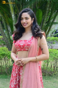 south actress malvika nair in a red lehenga choli