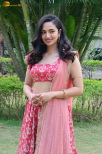 south actress malvika nair in a red lehenga choli