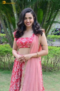 south actress malvika nair in a red lehenga choli