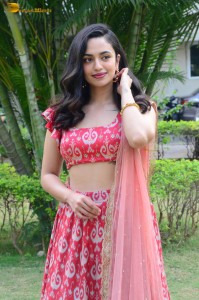 south actress malvika nair in a red lehenga choli