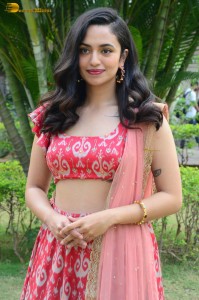 south actress malvika nair in a red lehenga choli