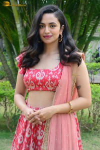 south actress malvika nair in a red lehenga choli