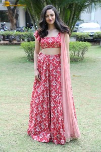 south actress malvika nair in a red lehenga choli