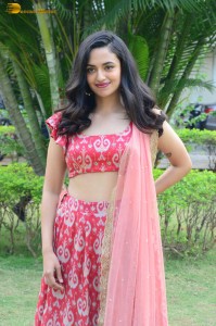 south actress malvika nair in a red lehenga choli