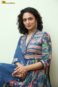 Actress malvika nair photoshoot in salwar dress and curly hair