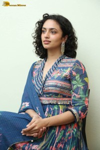 Actress malvika nair photoshoot in salwar dress and curly hair
