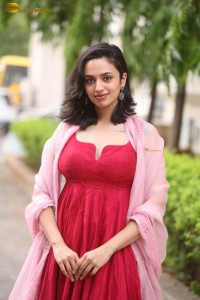 indian actress malvika nair cute looks in a red dress