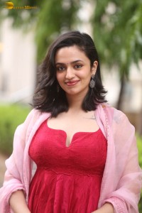 indian actress malvika nair cute looks in a red dress