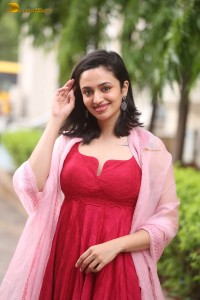 indian actress malvika nair cute looks in a red dress
