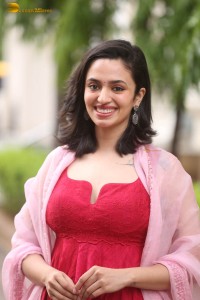 indian actress malvika nair cute looks in a red dress