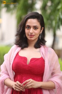 indian actress malvika nair cute looks in a red dress