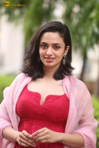 indian actress malvika nair cute looks in a red dress