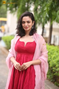 indian actress malvika nair cute looks in a red dress