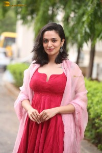indian actress malvika nair cute looks in a red dress