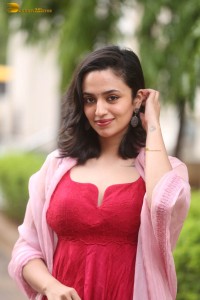 indian actress malvika nair cute looks in a red dress