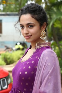 indian actress malvika nair in a dark pink salwar kameez dress