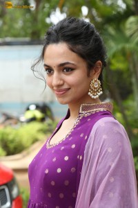 indian actress malvika nair in a dark pink salwar kameez dress