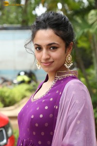 indian actress malvika nair in a dark pink salwar kameez dress