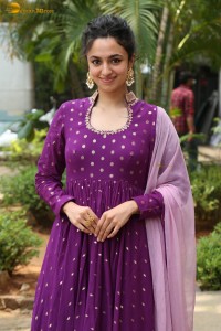 indian actress malvika nair in a dark pink salwar kameez dress