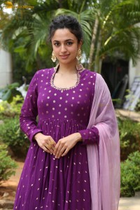 indian actress malvika nair in a dark pink salwar kameez dress