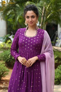 indian actress malvika nair in a dark pink salwar kameez dress