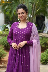 indian actress malvika nair in a dark pink salwar kameez dress