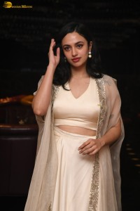 actress malvika nair lovely in a white dress