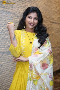 Singer Mangli in a yellow salwar dress