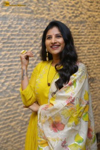 Singer Mangli in a yellow salwar dress