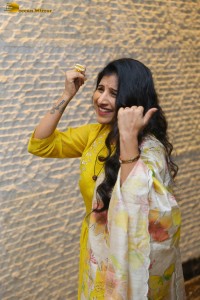 Singer Mangli in a yellow salwar dress