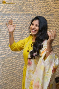 Singer Mangli in a yellow salwar dress