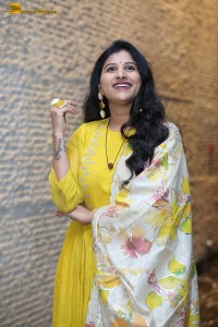 Singer Mangli in a yellow salwar dress