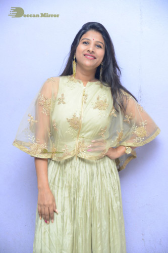 Telugu singer anchor actress Mangli photoshoot in a green dress