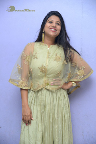 Telugu singer anchor actress Mangli photoshoot in a green dress
