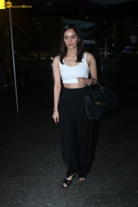 miss world and actress manushi chhillar glam look in a white tanktop at airport