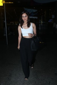 miss world and actress manushi chhillar glam look in a white tanktop at airport