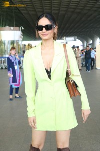 beauty queen manushi chhillar in a green mini dress at mumbai airport