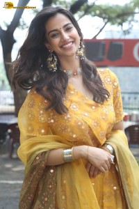 Indian actress meenakshi chaudhary in a yellow dress