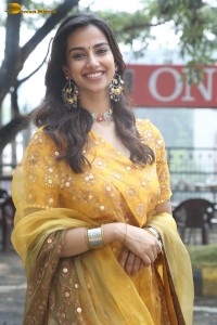 Indian actress meenakshi chaudhary in a yellow dress