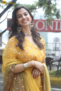 Indian actress meenakshi chaudhary in a yellow dress