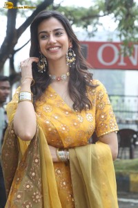 Indian actress meenakshi chaudhary in a yellow dress