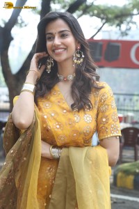 Indian actress meenakshi chaudhary in a yellow dress