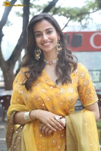 Indian actress meenakshi chaudhary in a yellow dress