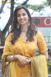 Indian actress meenakshi chaudhary in a yellow dress
