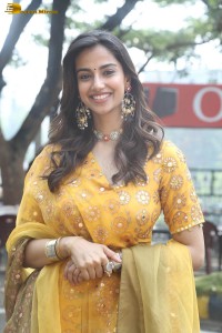 Indian actress meenakshi chaudhary in a yellow dress