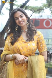 Indian actress meenakshi chaudhary in a yellow dress