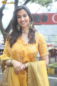 Indian actress meenakshi chaudhary in a yellow dress