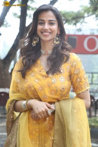 Indian actress meenakshi chaudhary in a yellow dress