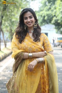 Indian actress meenakshi chaudhary in a yellow dress